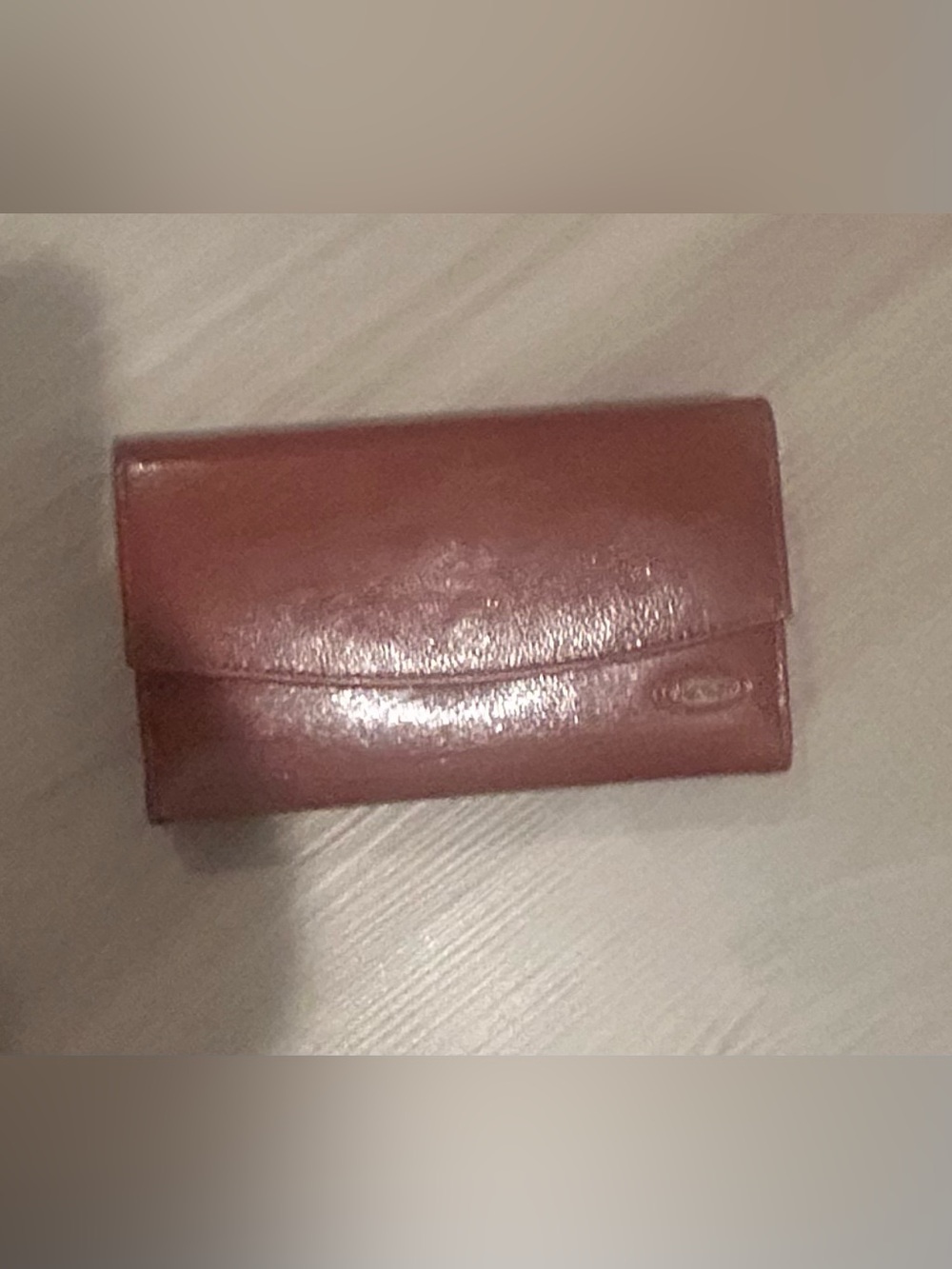 Rolfs brown leather card case with gold detail